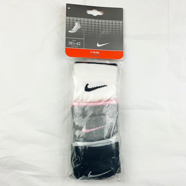 3 Per Pack Y2k Women's Deadstock Vintage Nike Sports Socks in White, Grey and Black. Socks has 3 different coloured Nike Swoosh. Black swoosh, Pink swoosh and white swoosh Colour: White, Grey & Black  Brand New with Tags -  Size on Tag: 5 - 8  All our items are of vintage conditions. This means some items may show signs of minor wear. Any major defects will be pictured and stated in the description