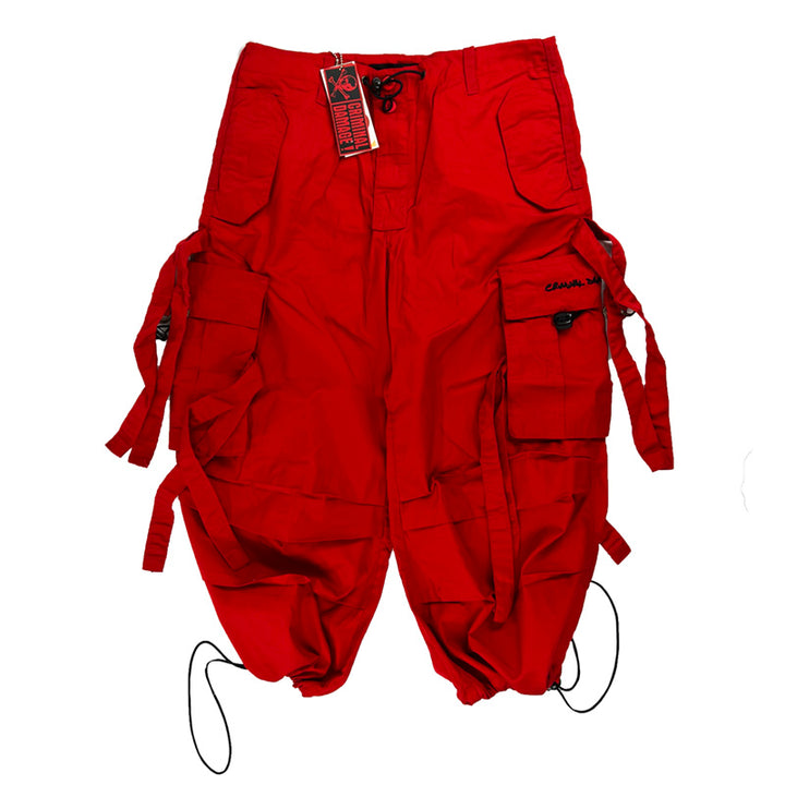Y2K Women's Deadstock Vintage Criminal Damage Drome cargo shorts in red with Criminal Damage branding. Lattice style parachute cargos. Adjustable drawstring to waist. Pockets to side. Material: Polyester/Cotton Colour: Red Brand New with Tags