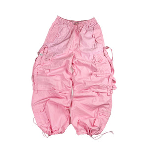 Super cute Deadstock Vintage Criminal Damage parachute cargo trousers in pink with Criminal Damage embroidered logo. Cord to waist. Plenty of pockets to sides and back. Lattice carnaby style. Adjustable cord to hem. Due to age you may need to tie the pull cord to keep in place Material: Polyester/Cotton Condition: Brand new with tags