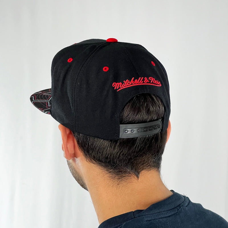mitchell and ness snapback on head