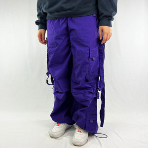 Super cute Deadstock Vintage Criminal Damage parachute cargo trousers in purple with Criminal Damage embroidered logo. Cord to waist. Plenty of pockets to sides and back. Lattice carnaby style. Adjustable cord to hem. Due to age you may need to tie the pull cord to keep in place Material: Polyester/Cotton