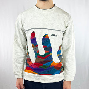 Vintage reworked Fila x COOGI Sweatshirt in white with spellout logo to chest. Crewneck. - Colour: White Condition: Good - Size on Tag: Small Measurements: Pit to Pit: 19.5 Inches Length: 25.5 Inches All our items are of vintage conditions. This means some items may show signs of minor wear. Any major defects will be pictured and/or stated in the description. We recommend to wash all vintage items before use.