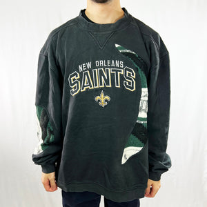 Vintage reworked New Orleans Saints x COOGI Sweatshirt in black with large spellout to chest. Crewneck. - Colour: Black Condition: Good - Size on Tag: XL Measurements: Pit to Pit: 28 Inches Length: 28.5 Inches