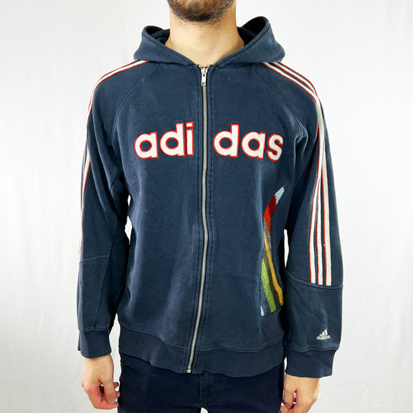 Navy Blue 90s style Feel timeless fashion with this reworked Adidas x COOGI full zip hoodie! Featuring the iconic spell out adidas logo. It's sure to have you looking like the talk of the town. Own some originality and make sure you stand out from the crowd! Condition: Good  - Size on Tag: Medium Measurements: Pit to Pit: 22 Inches Length: 25 Inches
