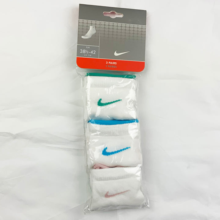 3 Per Pack Y2k Women's Deadstock Vintage Nike Sports Socks in White. Socks has 3 different coloured Nike Swoosh. Green swoosh, blue swoosh and pink swoosh Colour: White  Brand New with Tags -  Size on Tag: 5 - 8  All our items are of vintage conditions. This means some items may show signs of minor wear. Any major defects will be pictured and stated in the description