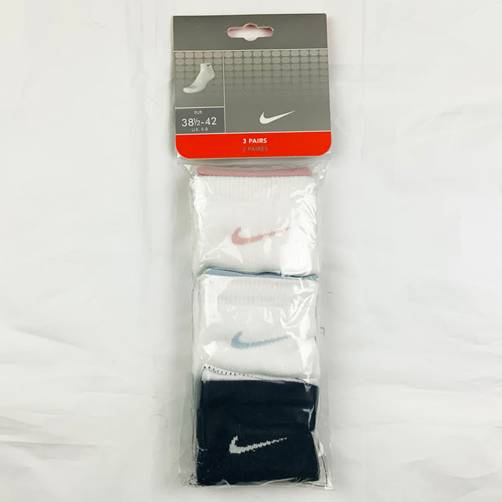 3 Per Pack Y2k Women's Deadstock Vintage Nike Sports Socks in White and Black. Socks has 3 different coloured Nike Swoosh. Pink swoosh, light blue swoosh and white swoosh Colour: White & Black  Brand New with Tags -  Size on Tag: 5 - 8  All our items are of vintage conditions. This means some items may show signs of minor wear. Any major defects will be pictured and stated in the description