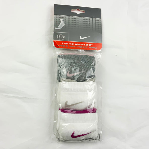 3 Per Pack Y2k Women's Deadstock Vintage Nike Sports Socks in White and Grey. Socks has 3 different coloured Nike Swoosh. Pink swoosh, grey swoosh and purple swoosh Colour: White & Grey  Brand New with Tags -  Size on Tag: 2.5 - 5  All our items are of vintage conditions. This means some items may show signs of minor wear. Any major defects will be pictured and stated in the description