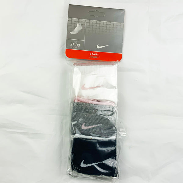 3 Per Pack Y2k Women's Deadstock Vintage Nike Sports Socks in White, Grey and Black. Socks has 3 different coloured Nike Swoosh. Pink swoosh, pink swoosh and white swoosh Colour: White, Grey & Black  Brand New with Tags -  Size on Tag: 2.5 - 5  All our items are of vintage conditions. This means some items may show signs of minor wear. Any major defects will be pictured and stated in the description