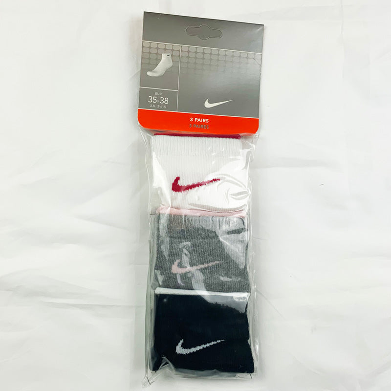 3 Per Pack Y2k Women's Deadstock Vintage Nike Sports Socks in White, Grey and Black. Socks has 3 different coloured Nike Swoosh. Hot Pink swoosh, pink swoosh and white swoosh Colour: White, Grey & Black  Brand New with Tags -  Size on Tag: 2.5 - 5  All our items are of vintage conditions. This means some items may show signs of minor wear. Any major defects will be pictured and stated in the description