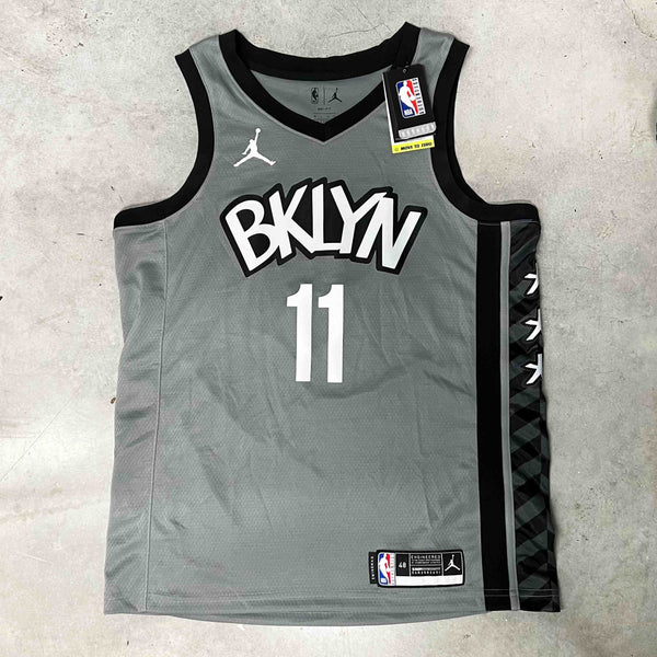 NBA Brooklyn Nets Swingman Jersey in Grey with No 11 Irving printed on the back. Brand new with tags Size on Tag: Large  Measurements:  Pit to Pit: 22.5 inches  Length: 30 inches