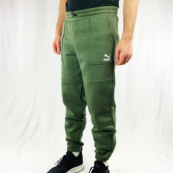 Deadstock Puma Sportswear Joggers in khaki green with Puma spellout. Pockets on side, adjustable cord on waist and cuffed ankles