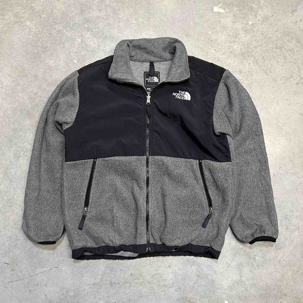 The North Face denali fleece in grey and black. Size on tag: Boys Large  Measurements:  Pit to Pit: 20.5 inches  Length: 24 inches