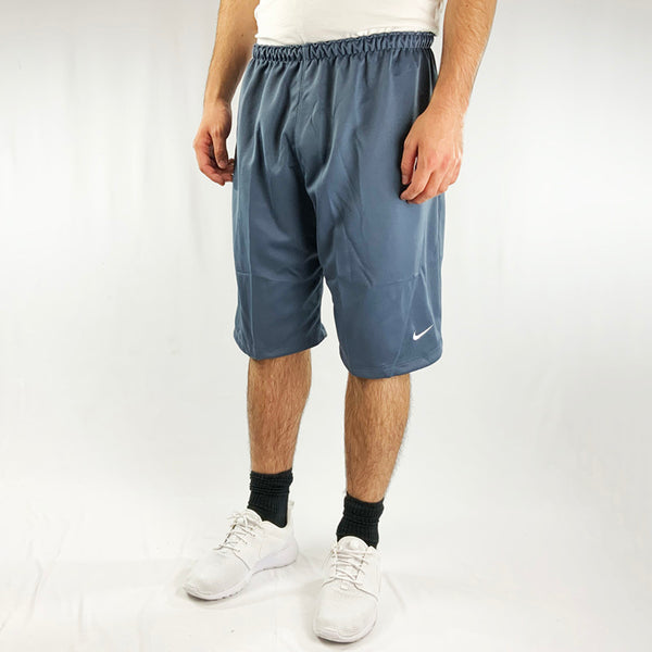 2003 Deadstock Vintage Nike Football shorts in blue. Nike swoosh to front. Adjustable drawstring to waist. Perfect for sports and summer! Colour: Blue Brand New with Tags
