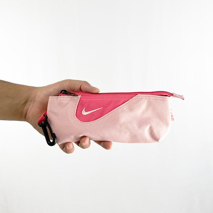 Y2k Deadstock Vintage Nike Swoosh multi purpose bag in pink with embroidered Nike swoosh. This bag can be used to keep your pens and pencils to keep you on top of your knowledge, it can also be your new makeup bag, it's your choice. Materials: Polyester/Nylon  Colour: Pink Brand New