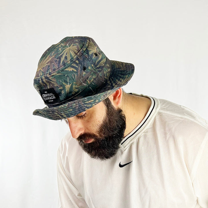 Deadstock Vintage Criminal Damage bucket hat  in camo with Criminal Damage branding. Camo effect with leaves. Colour: Camo Brand New  -  Adult Unisex