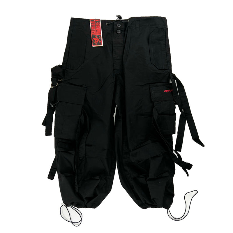 Y2K Women's Deadstock Vintage Criminal Damage Drome cargo shorts in black with Criminal Damage branding. Lattice style parachute cargos. Adjustable drawstring to waist. Pockets to side. Adjustable cord to hem. Material: Polyester/Cotton Colour: Black Brand New with Tags
