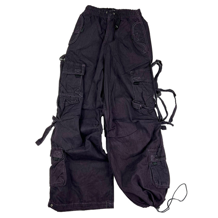 Super cute Deadstock Vintage Criminal Damage parachute cargo trousers in dark purple with Criminal Damage embroidered logo. Cord to waist. Plenty of pockets to sides and back. Lattice carnaby style. Adjustable cord to hem. One of the cords at hem is missing. Due to age you may need to tie the pull cord to keep in place Material: Polyester/Cotton Condition: Brand new with tags