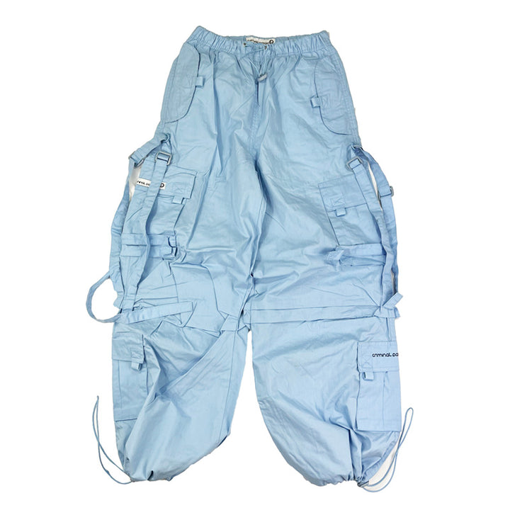 Super cute ﻿Deadstock Vintage Criminal Damage parachute cargo trousers in light blue with Criminal Damage embroidered logo. Cord to waist. Plenty of pockets to sides and back. Lattice carnaby style. Adjustable cord to hem. Due to age you may need to tie the pull cord to keep in place Material: Polyester/Cotton