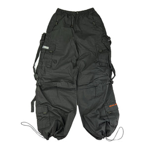 Super cute ﻿Deadstock Vintage Criminal Damage parachute cargo trousers in dark grey with Criminal Damage embroidered logo. Cord to waist. Plenty of pockets to sides and back. Lattice carnaby style. Adjustable cord to hem. Due to age you may need to tie the pull cord to keep in place Material: Polyester/Cotton Condition: Brand new with tags Measurements:  - Size on Tag: Medium Length: 44 Inches Inseam: 32 Inches