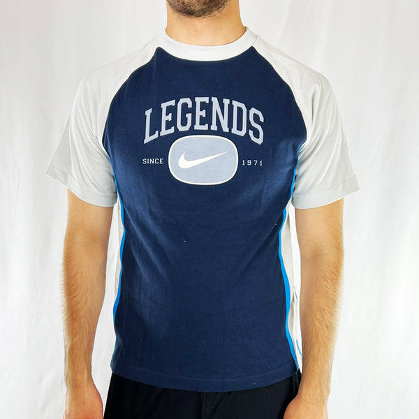 Boys Y2K Deadstock Vintage Nike Legends T-shirt in navy blue. Nike swoosh since 1971 across chest with LEGENDS spellout. Limited edition. Perfect for summer.  Material: Cotton Colour: Navy Blue Brand New with Tags