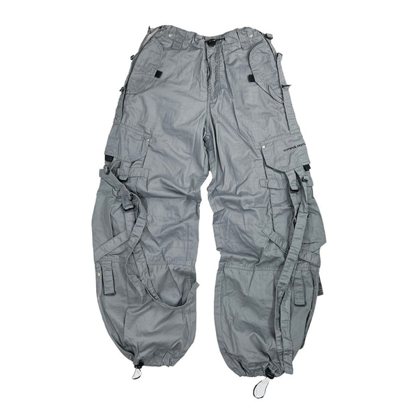 Super cute Deadstock Vintage Criminal Damage parachute cargo trousers in grey with Criminal Damage embroidered logo. Cord to waist. Plenty of pockets to sides and back. Lattice carnaby style. Adjustable cord to hem. Due to age you may need to tie the pull cord to keep in place Material: Polyester/Cotton Condition: Brand new with tags Measurements:  - Size on Tag: Medium Length: 42 Inches Inseam: 30.5 Inches