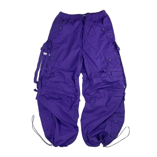 Kids ﻿Deadstock Vintage Criminal Damage parachute cargo trousers in purple with Criminal Damage embroidered logo. Cord to waist. Plenty of pockets to sides and back. Carnaby style. Adjustable cord to hem. Due to age you may need to tie the pull cord to keep in place
