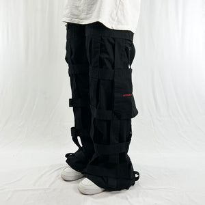 Deadstock Vintage Criminal Damage Lattice Cargo Trousers in black with Criminal Damage branding. High-waisted trousers. Pockets to sides. Belt loops for belt adjustment. Condition: Brand new with tags Measurements:  - Size on Tag: 26 Inseam: 31 Inches Length: 39.5 Inches Waist: 28 Inches Hips: 33 Inches