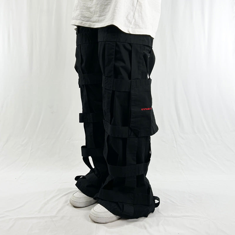 Deadstock Vintage Criminal Damage Lattice Cargo Trousers in black with Criminal Damage branding. High-waisted trousers. Pockets to sides. Belt loops for belt adjustment. Condition: Brand new with tags Measurements:  - Size on Tag: 26 Inseam: 31 Inches Length: 39.5 Inches Waist: 28 Inches Hips: 33 Inches