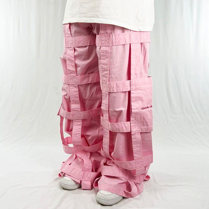 Deadstock Vintage Criminal Damage Lattice Cargo Trousers in pink with Criminal Damage branding. High-waisted trousers. Pockets to sides. Belt loops for belt adjustment. Materials: Polyester/Cotton Condition: Brand new with tags Measurements:  - Size on Tag: 32 Inseam: 32 Inches Length: 42 Inches Waist: 34 Inches