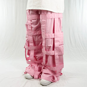 Deadstock Vintage Criminal Damage Lattice Cargo Trousers in pink with Criminal Damage branding. High-waisted trousers. Pockets to sides. Belt loops for belt adjustment. Materials: Polyester/Cotton Condition: Brand new with tags Measurements:  - Size on Tag: 32 Inseam: 32 Inches Length: 42 Inches Waist: 34 Inches