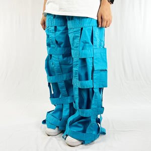 Deadstock Vintage Criminal Damage Lattice Cargo Trousers in blue with Criminal Damage branding. High-waisted trousers. Pockets to sides. Belt loops for belt adjustment. Materials: Polyester/Cotton Condition: Brand new with tags Measurements:  - Size on Tag: 32