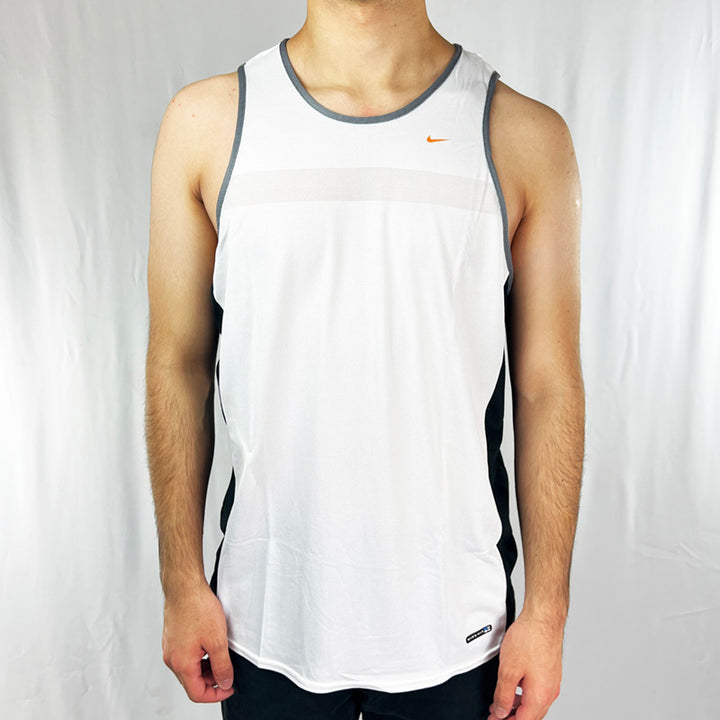 90s Deadstock Vintage Nike Fit Training Tank Top in white with Nike swoosh to chest. Material: Polyester Colour: White Brand New with Tags _ Size on Tag: XL Measurements: Pit to Pit: 23 Inches Length: 28.5 Inches