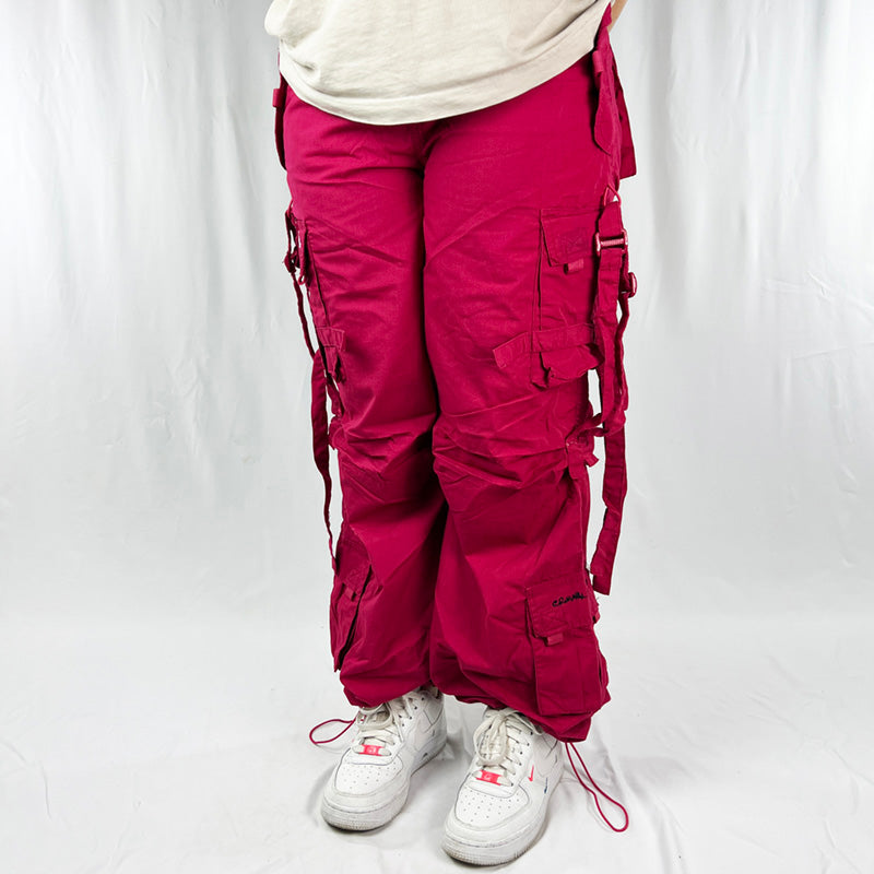 Super cute Youth Deadstock Vintage Criminal Damage parachute cargo trousers in black with Criminal Damage embroidered logo. Cord to waist. Plenty of pockets to sides and back. Lattice carnaby style. Adjustable cord to hem. Due to age you may need to tie the pull cord to keep in place Material: Polyester/Cotton Condition: Brand new with tags Measurements:  - Size on Tag: Youth L/B (fits adult small) Length: 40 Inches Inseam: 28.5 Inches Waist: 24-33 Inches