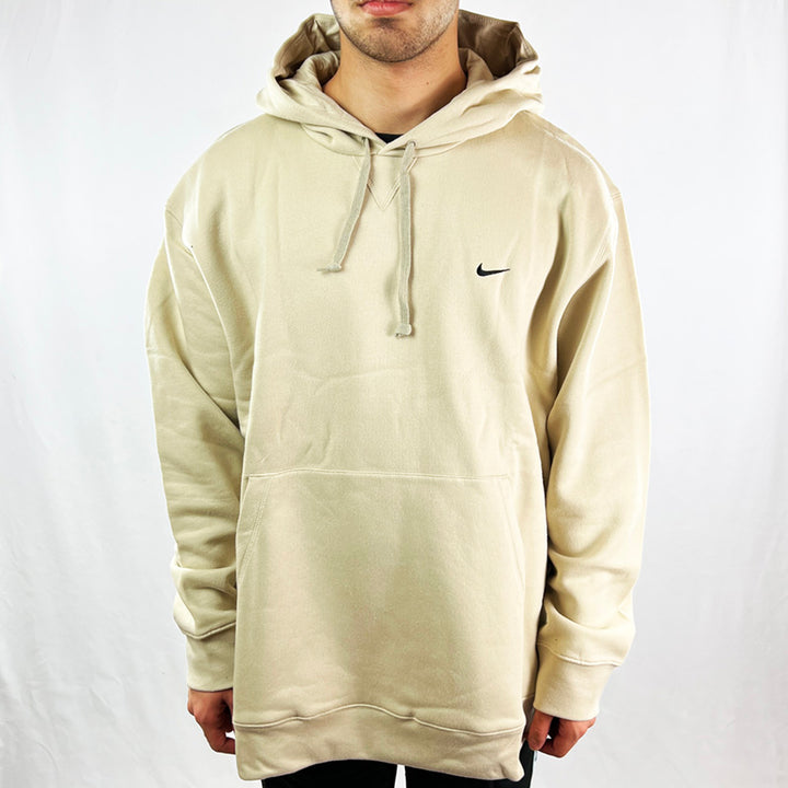 Y2K Deadstock Vintage Nike Swoosh hoodie in beige. Embroidered Nike swoosh logo to chest. Kangaroo pocket to front. Hood with adjustable drawstrings. Comfortable and cosy. - Materials: 80% Cotton - 20% Polyester - Colour: Beige Brand New with Tags - Size on Tag: XXL Measurements: Pit to Pit: 27 Inches Length: 31.5 Inches