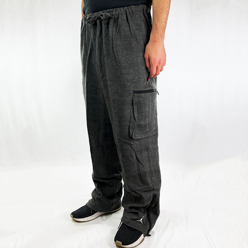 90s Deadstock Vintage Jordan joggers in dark grey. Jordan logo to hem and between side pocket. MJ Michael Jordan initials to side pocket. Adjustable drawstrings to waist. Zip closure to hem. - Materials: 60% Cotton - 40% Polyester - Colour: Grey Brand New with Tags