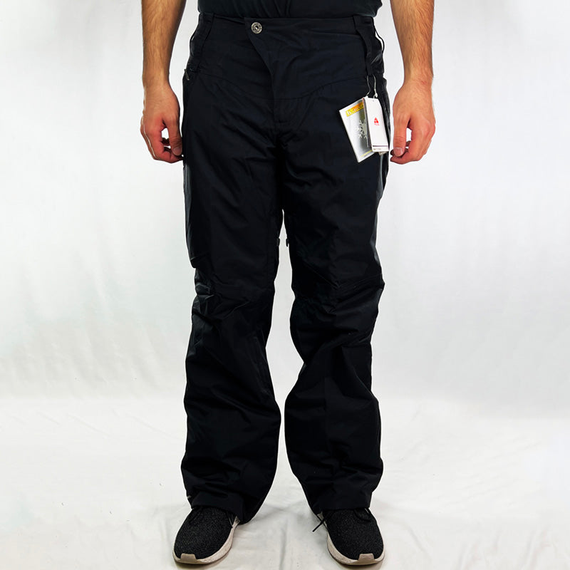 Y2K Women's Deadstock Vintage Nike ACG Cargo Ski Pants in black with Nike ACG branding. Storm-Fit technology. Thermore light insulation fleeced inner layer. Zip pockets. Boot gaiters. Belt loops for belt adjustment. - Materials:  Body: Nylon Fill: Polyester