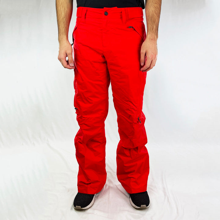 Y2K Women's Deadstock Vintage Nike ACG Cargo Ski Pants in red with Nike ACG branding. Storm-Fit technology. Thermore light insulation fleeced inner layer. Zip pockets. Boot gaiters. Belt loops for belt adjustment. - Materials:  Body: Nylon Fill: Polyester - Colour: Red Brand New with Tags