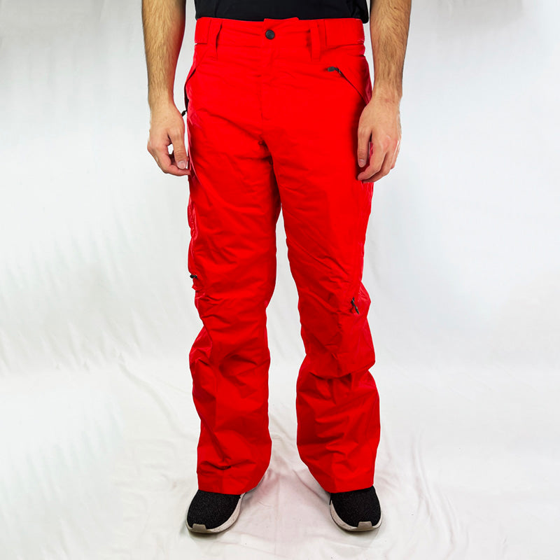 Y2K Women's Deadstock Vintage Nike ACG Cargo Ski Pants in red with Nike ACG branding. Storm-Fit technology. Thermore light insulation fleeced inner layer. Zip pockets. Boot gaiters. Belt loops for belt adjustment. - Materials:  Body: Nylon Fill: Polyester - Colour: Red Brand New with Tags