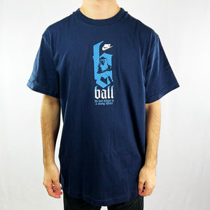 Y2K Deadstock Vintage Nike basketball t-shirt in navy blue. Spellout 'the best defence is a strong offence' and Nike logo across chest with basketball player. Embroidered logo behind neck with Flight spellout. Crew neck t-shirt. Material: Cotton Colour: Black Brand New with Tags