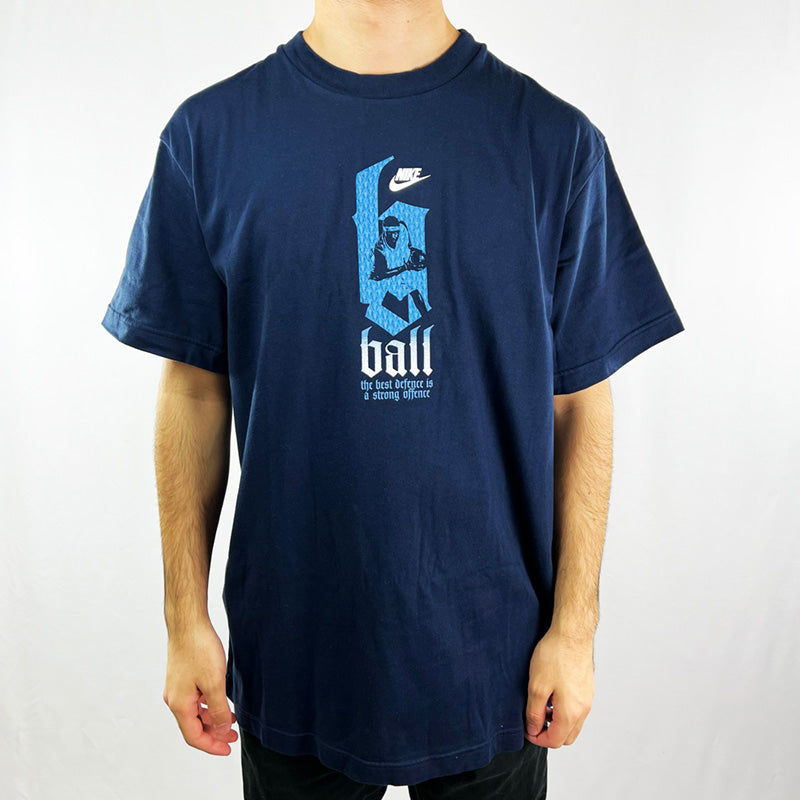 Y2K Deadstock Vintage Nike basketball t-shirt in navy blue. Spellout 'the best defence is a strong offence' and Nike logo across chest with basketball player. Embroidered logo behind neck with Flight spellout. Crew neck t-shirt. Material: Cotton Colour: Black Brand New with Tags