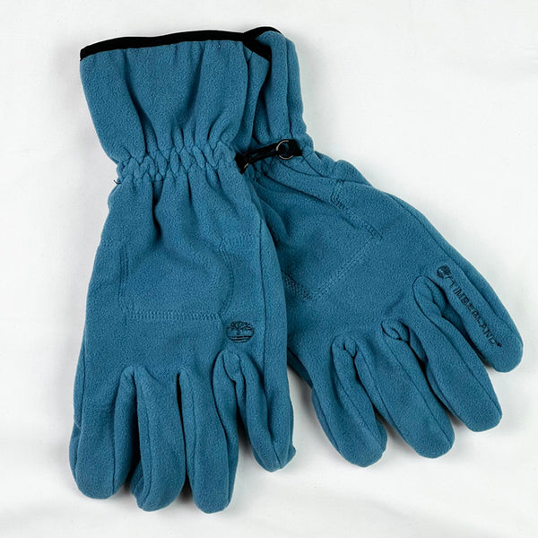 Deadstock Timberland gloves in blue with Timberland branding. Connectors to connect both gloves. elastic wrist. Fleeced inner layer. - Materials: Polyester - Colour: Blue Brand New with Tags - Size on Tag: XL