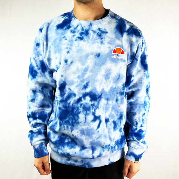 Ellesse Diveria sweatshirt in blue tie dye. Ellesse print spellout to chest. Comfortable and cosy. - Materials: 100% Cotton - Size on Tag: Large Measurements: Pit to Pit: 23.5 Inches Length: 30 Inches - Size on Tag: XXL Measurements: Pit to Pit: 26 Inches Length: 30 Inches