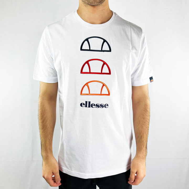 Ellesse Fever t-shirt in white. Ellesse spellout to front with 3 embroidered ellesse logo in different colours. Crew neck t-shirt. Logo to sleeve. Material: 100% Cotton Colour: White Brand New with Tags