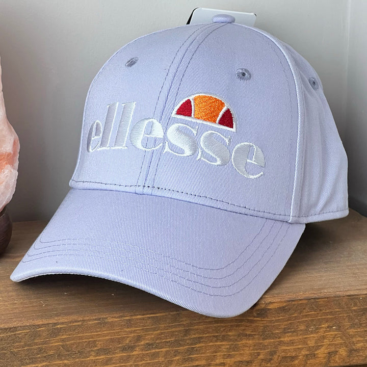 Deadstock Ellesse Ragusa cap in purple. Curved visor. Ellesse spellout to front. Adjustable strapback. Materials: 100% Cotton Colour: Purple Brand New with Tags - Size on Tag: One Size