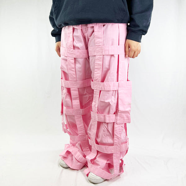 Deadstock Vintage Criminal Damage Lattice Cargo Trousers in pink with Criminal Damage branding. High-waisted trousers. Pockets to sides. Belt loops for belt adjustment. Punk rave vibes. Materials: Polyester/Cotton Condition: Brand new with tags Measurements:
