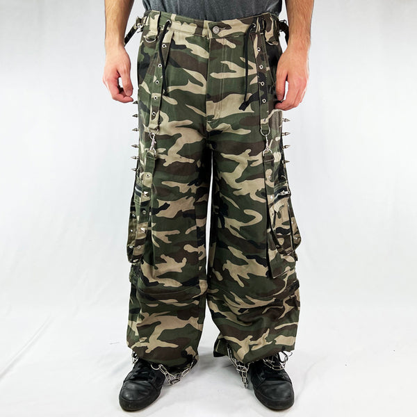 Deadstock Vintage Criminal Damage Mallet Cargo Trousers in Camo with Criminal Damage branding. Plenty of pockets. Belt loops and adjustable drawstring to waist.belt. Zip closure to hem. Spikes on sides. Chains to hem. Punk vibes. Condition: Brand new with tags Measurements:  - Size on Tag: 34 Inseam: 32.5 Inches Waist: W34