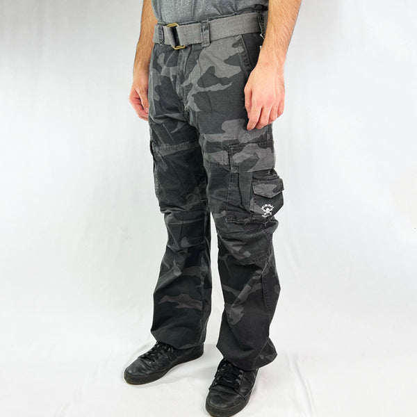 Deadstock Vintage Criminal Damage Slice Cargo Trousers in Black Camo with Criminal Damage branding. Plenty of pockets. Belt loops to waist and comes with Criminal Damage branded belt. Adjustable drawstring to hem.  Condition: Brand new with tags Measurements:  - Size on Tag: 32 Inseam: 33 Inches Waist: W32