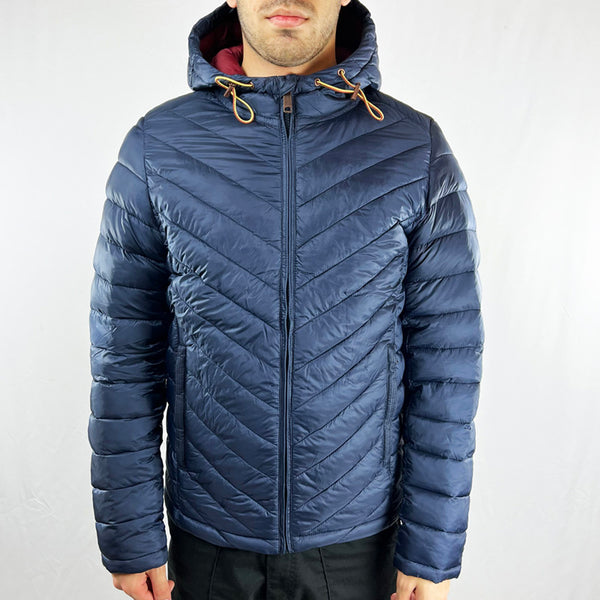 Deadstock Timberland quilted puffer jacket in navy blue. Timberland logo to upper sleeve. Zip pockets to front. Zip closure to jacket. Hooded with cords for adjustment. Packable lightweight jacket. - Materials: Polyester - Colour: Navy Blue Brand New with Tags - Size on Tag: Small Measurements: Pit to Pit: 20.5 Inches Length: 26.5 Inches