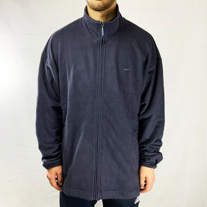 90s Deadstock Vintage Nike Fleece in Navy Blue with embroidered swoosh to chest and embroidered spellout behind neck. Colour: Navy Blue Brand New with Tags Size on Tag: XL MEASUREMENTS: Pit to Pit: 26 INCHES Length: 30.5 INCHES All our items are of vintage conditions. This means some items may show signs of minor wear. Any major defects will be pictured and stated in the description