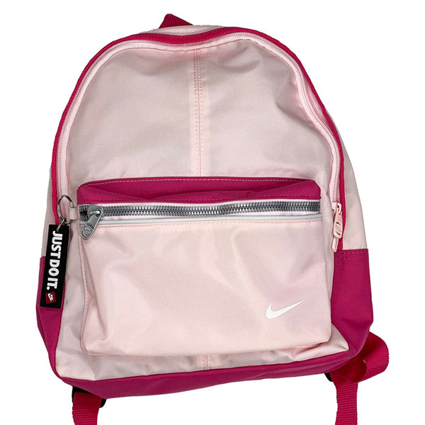 Deadstock Vintage Nike Just Do It backpack bag in pink. Zip around closure. front zip pocket. Just Do It charm. Small backpack. Colour: Pink Brand New with Tag One Size